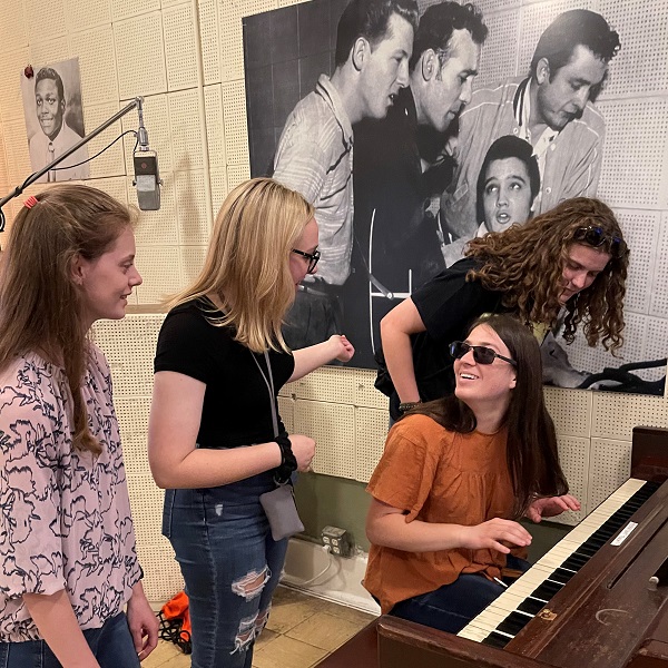 students at the piano